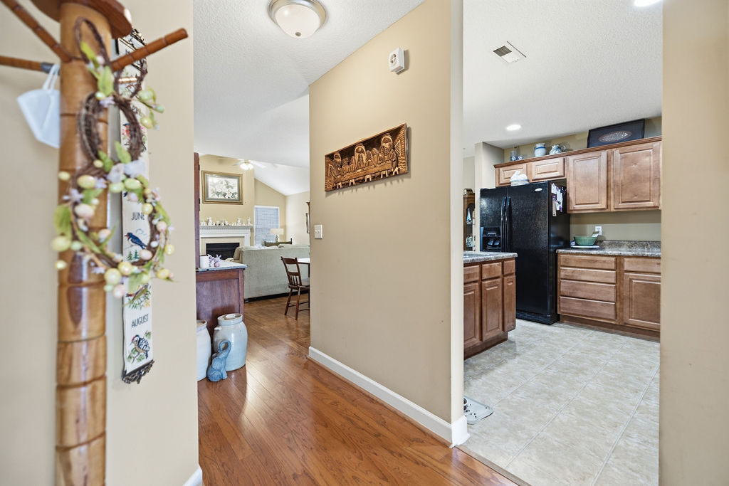 This inviting interior features a well-appointed kitchen and an open view to the family room.