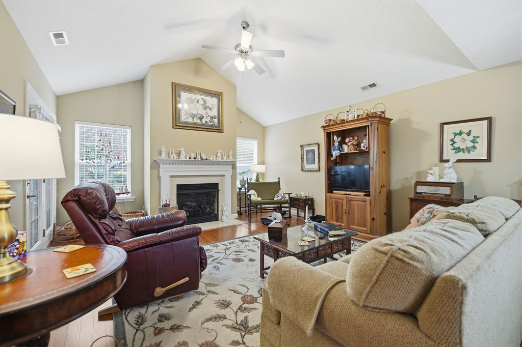 109 Abigail Lane Anderson, SC 29621 - Photo 8 of 29 This inviting living room features a fireplace, providing a warm and comforting atmosphere.