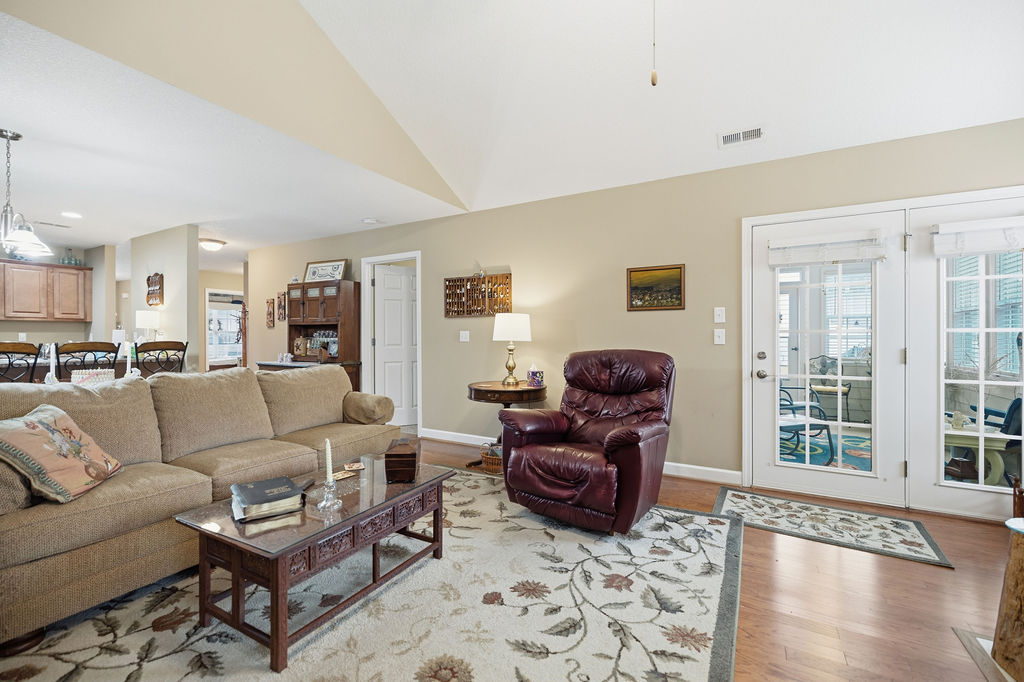 109 Abigail Lane Anderson, SC 29621 - Photo 10 of 29 This inviting living room features warm wood flooring and convenient access to an outdoor area.