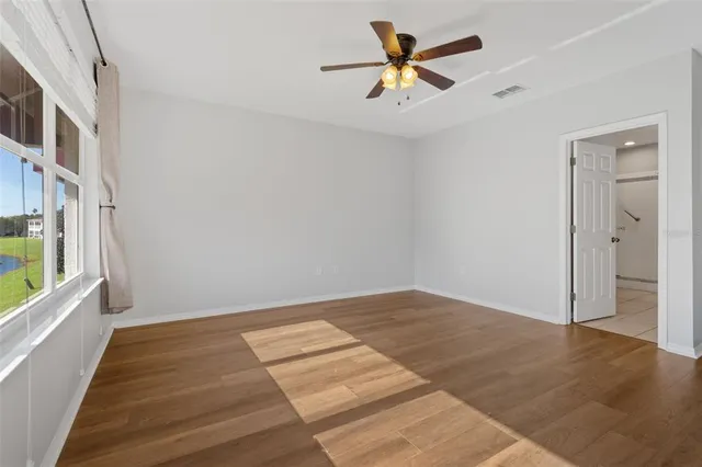 a spacious bathroom with a shower sink and mirror