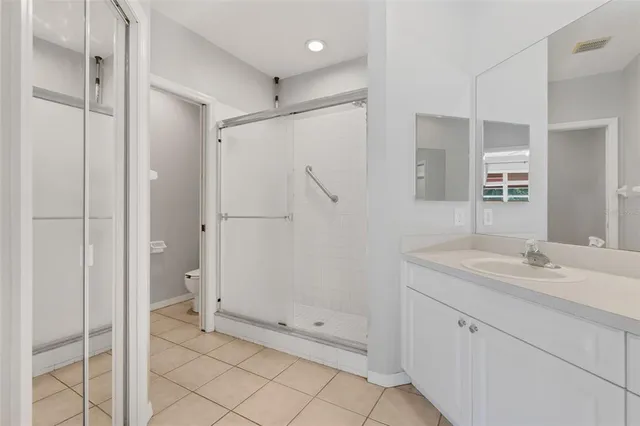 a view of a room with wooden floor and window