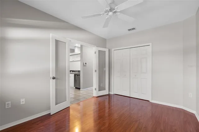 a kitchen with white cabinets stainless steel appliances and a sink