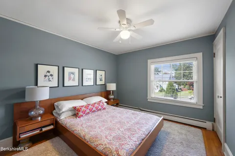 a bedroom with a large bed and a window