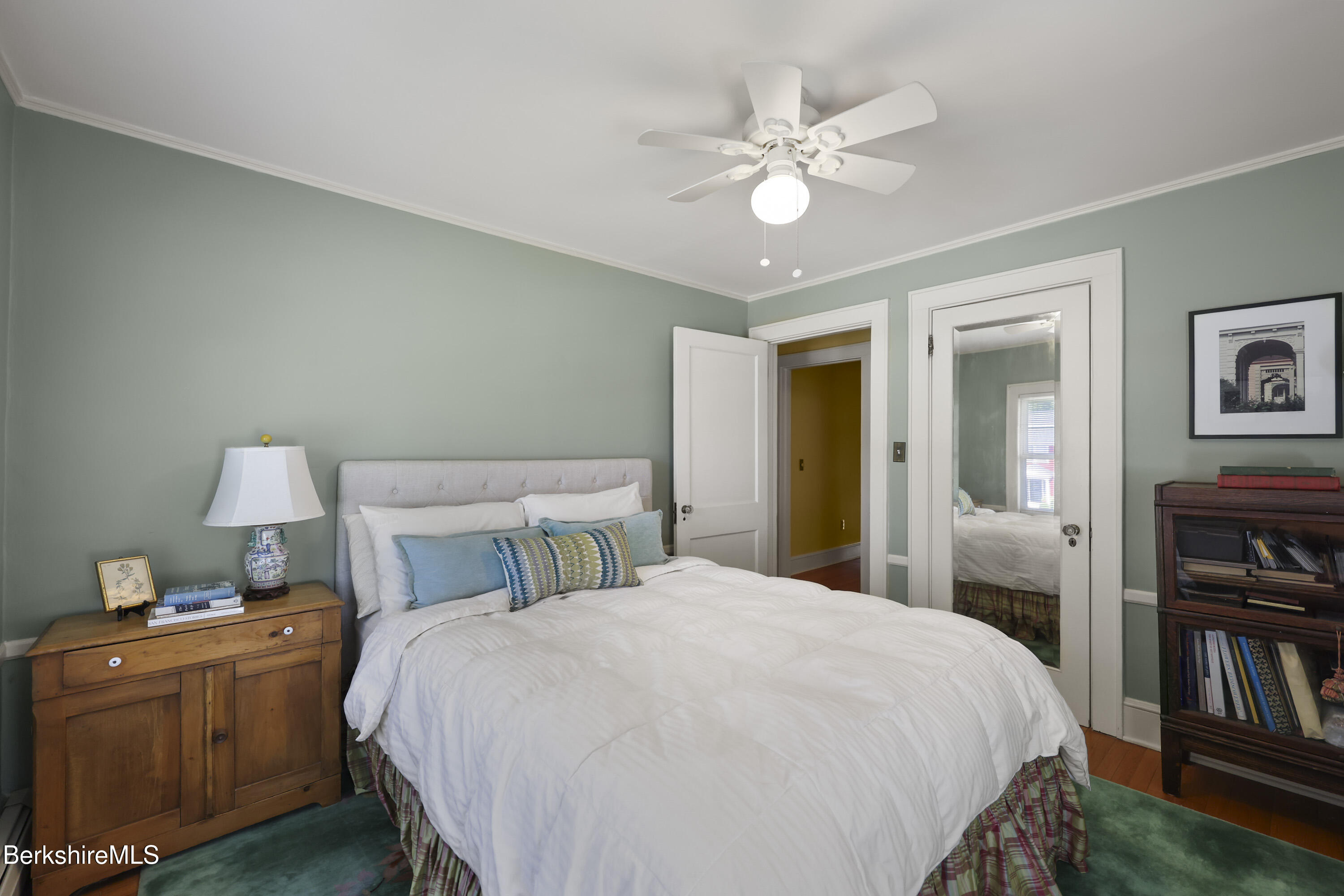 39 Lexington Parkway Pittsfield, MA 01201 - Photo 23 of 48 a bedroom with a bed and a chandelier