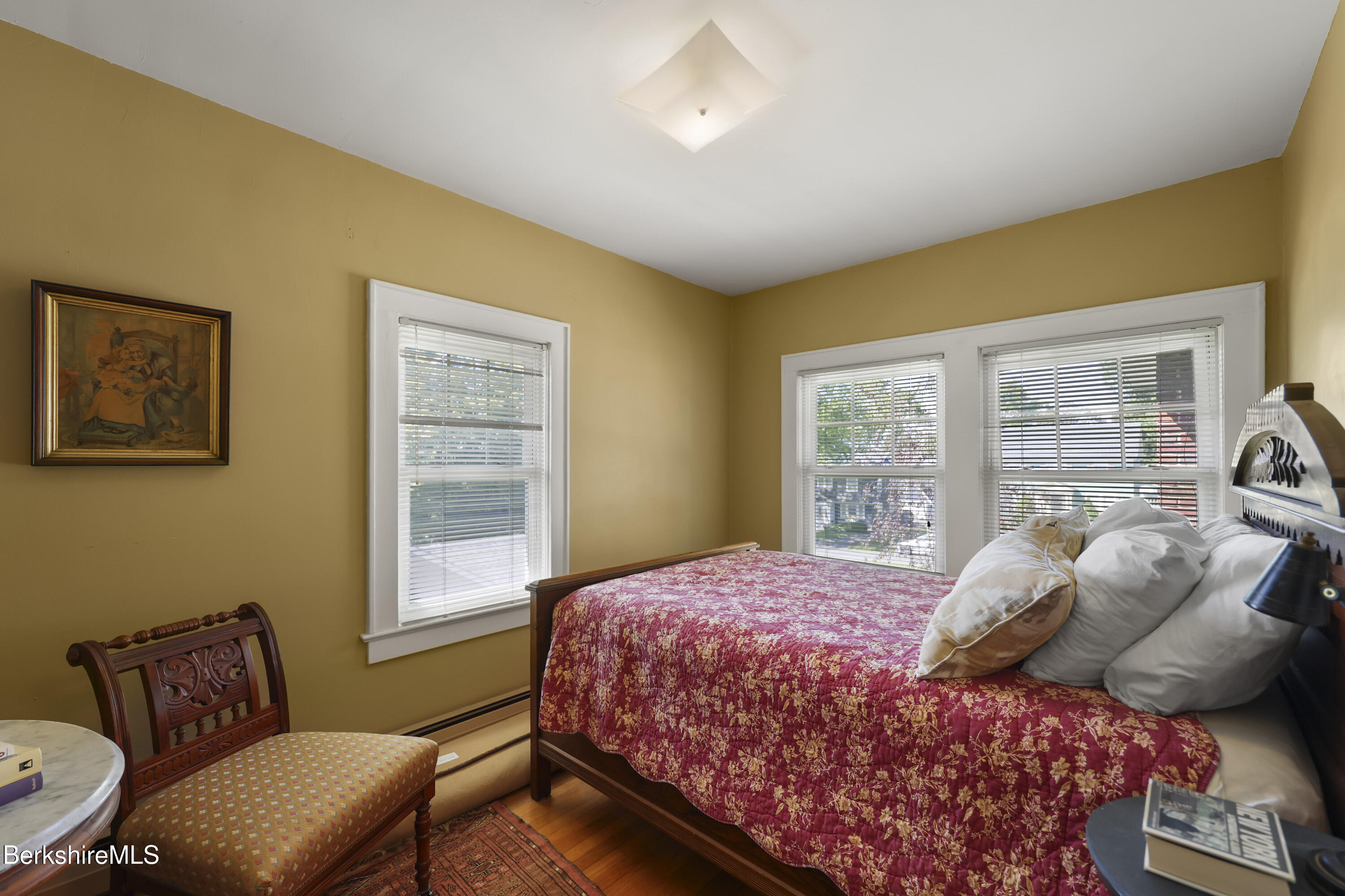 39 Lexington Parkway Pittsfield, MA 01201 - Photo 25 of 48 a bedroom with a bed and wooden floor