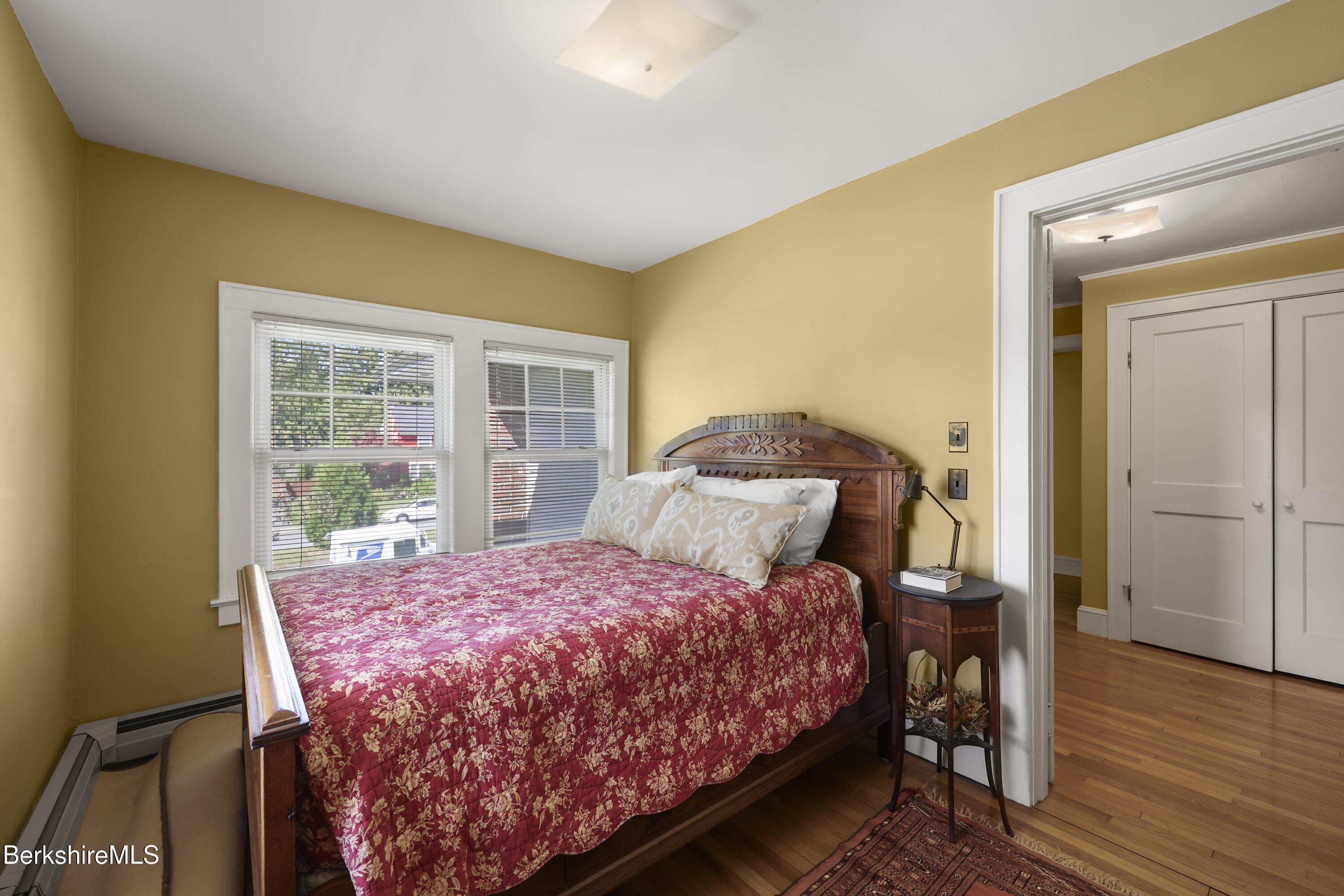 39 Lexington Parkway Pittsfield, MA 01201 - Photo 26 of 48 a bedroom with a bed and wooden floor