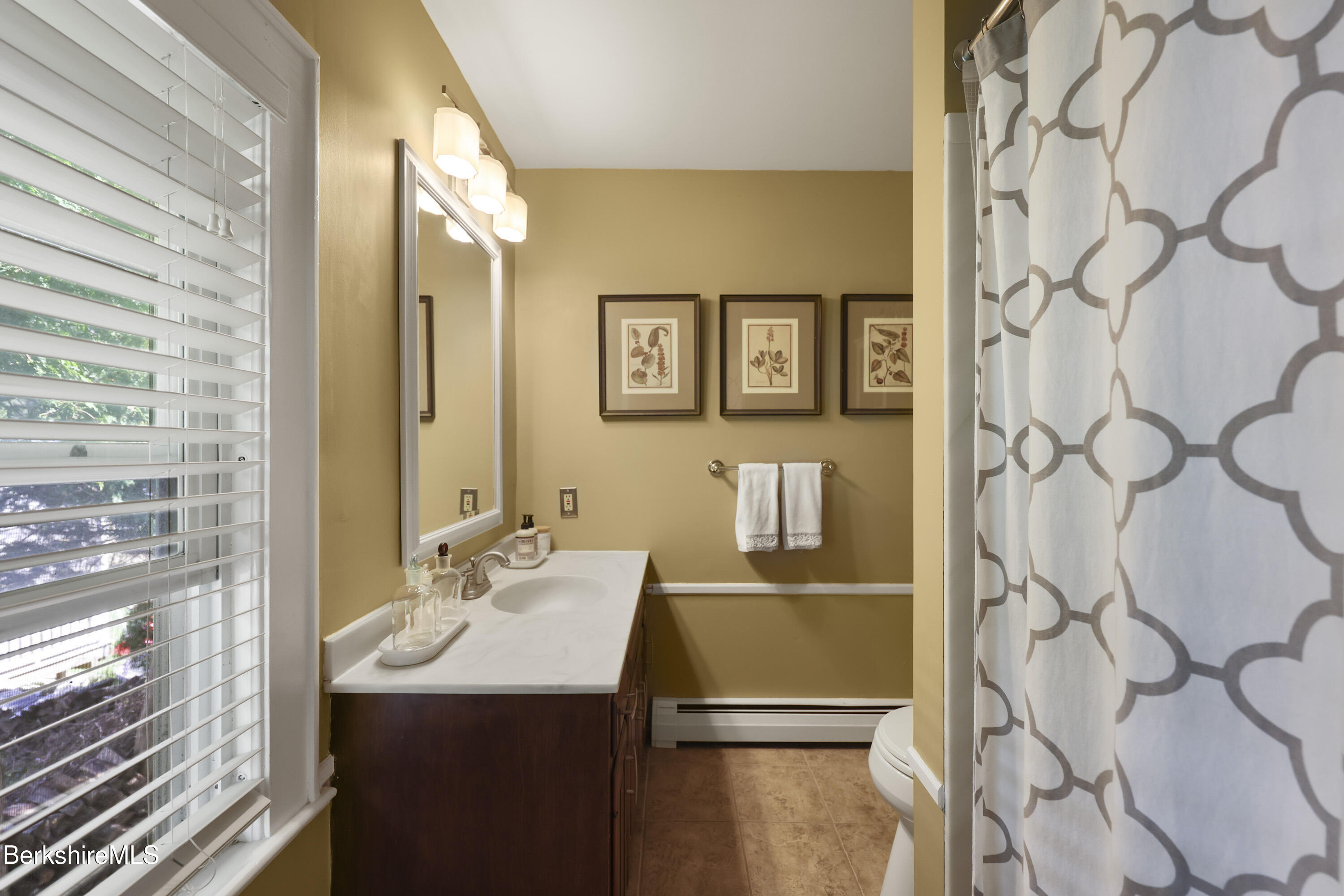 39 Lexington Parkway Pittsfield, MA 01201 - Photo 27 of 48 a bathroom with a sink and a mirror