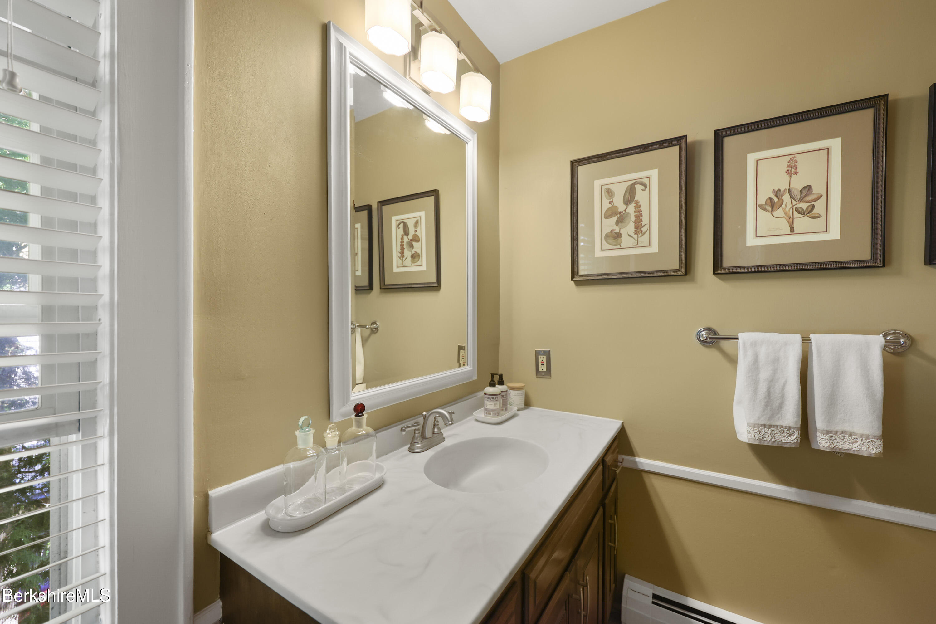 39 Lexington Parkway Pittsfield, MA 01201 - Photo 28 of 48 a bathroom with a sink vanity and a mirror