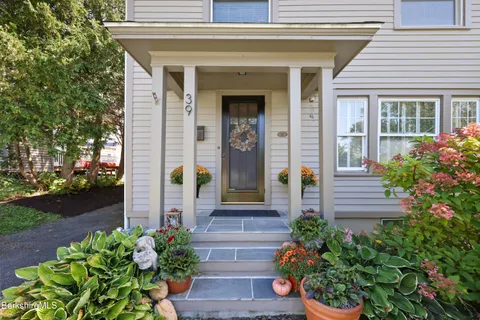 a front view of a house with a porch