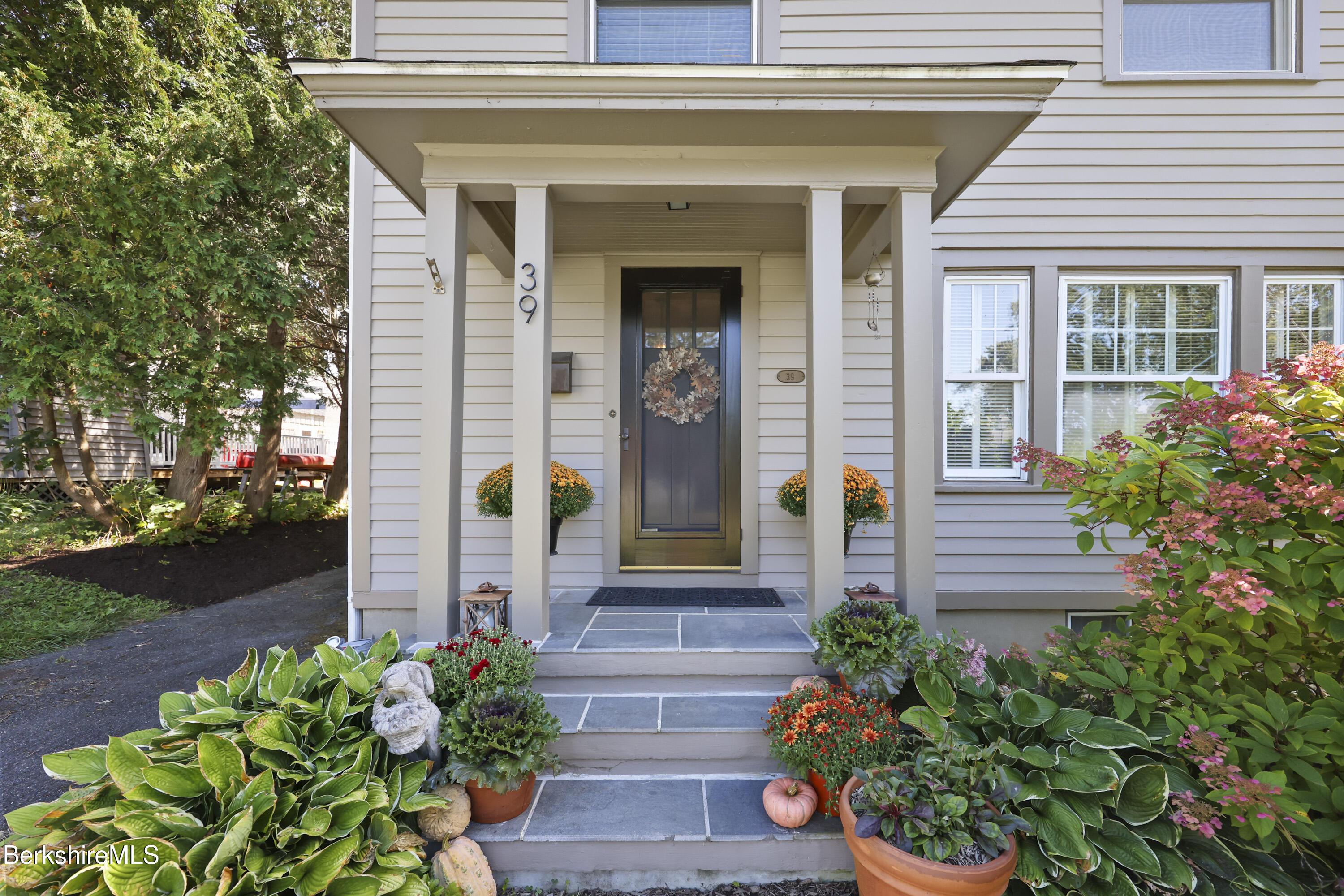 39 Lexington Parkway Pittsfield, MA 01201 - Photo 3 of 48 a front view of a house with a porch