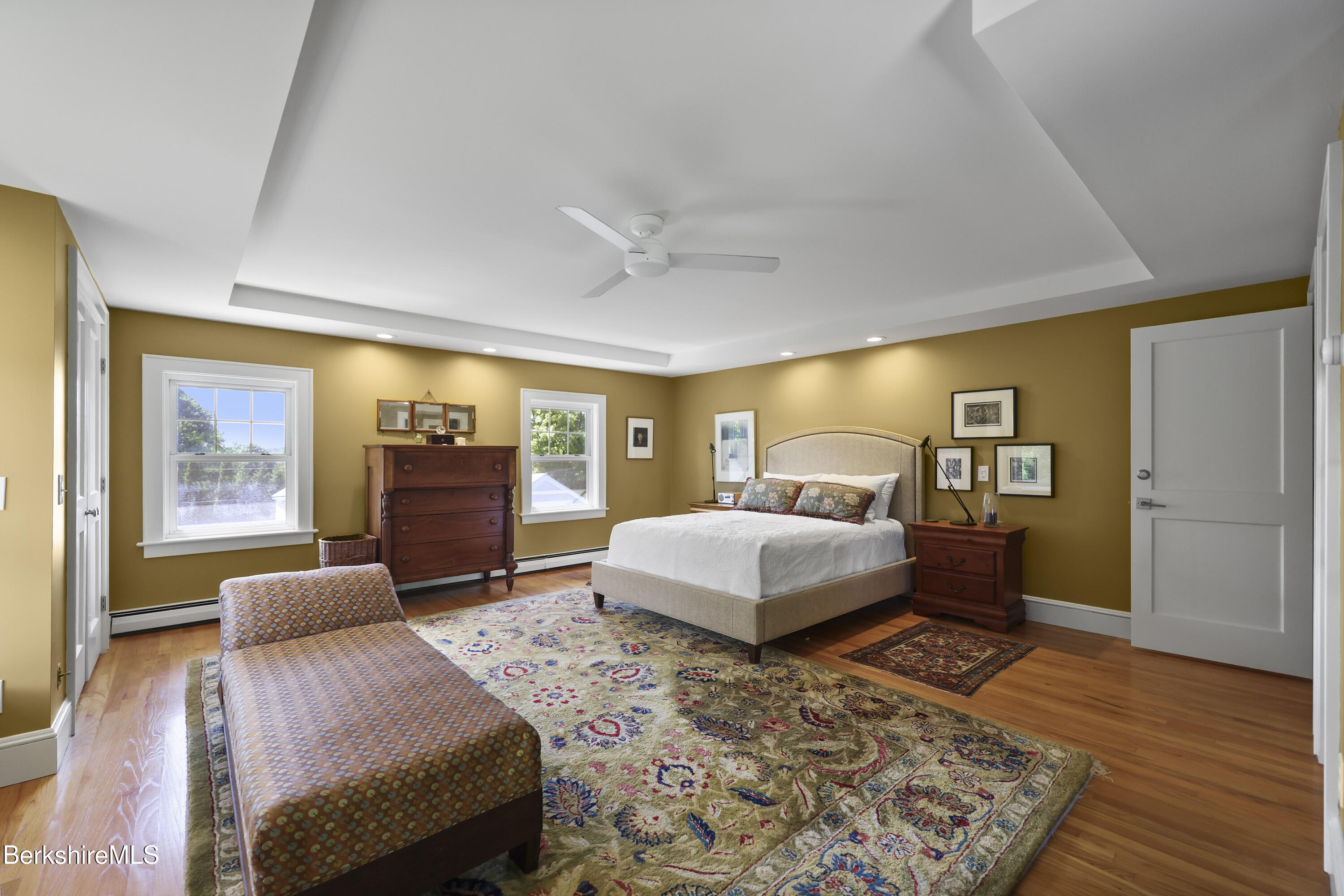 39 Lexington Parkway Pittsfield, MA 01201 - Photo 32 of 48 a bedroom with a large bed and wooden floor