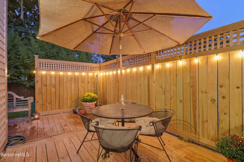 a patio with table and chairs