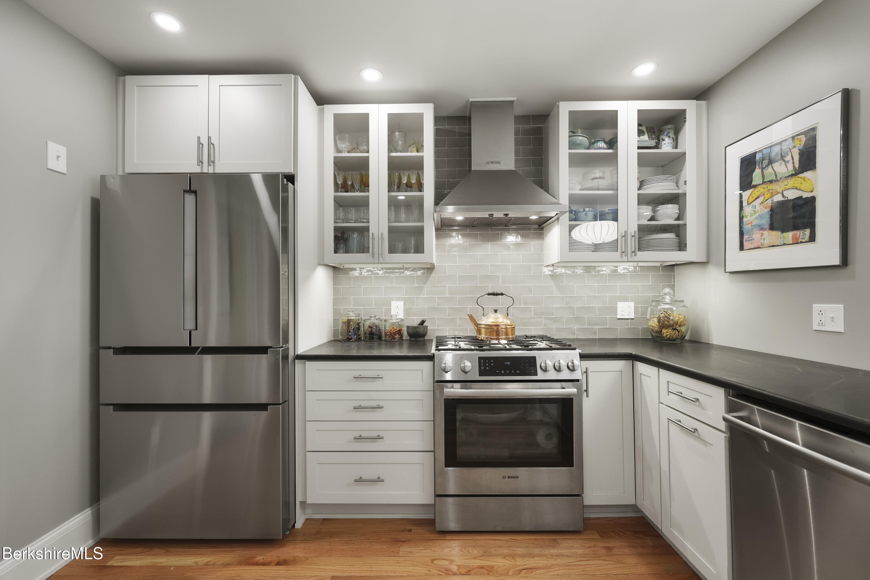39 Lexington Parkway Pittsfield, MA 01201 - Photo 5 of 48 a kitchen with stainless steel appliances granite countertop a refrigerator and a stove top oven