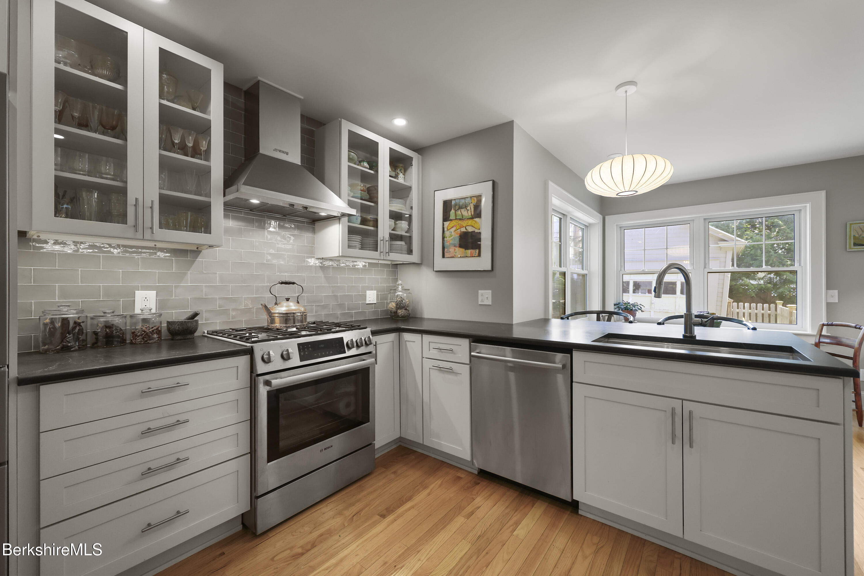 39 Lexington Parkway Pittsfield, MA 01201 - Photo 6 of 48 a kitchen with stainless steel appliances granite countertop a sink and cabinets