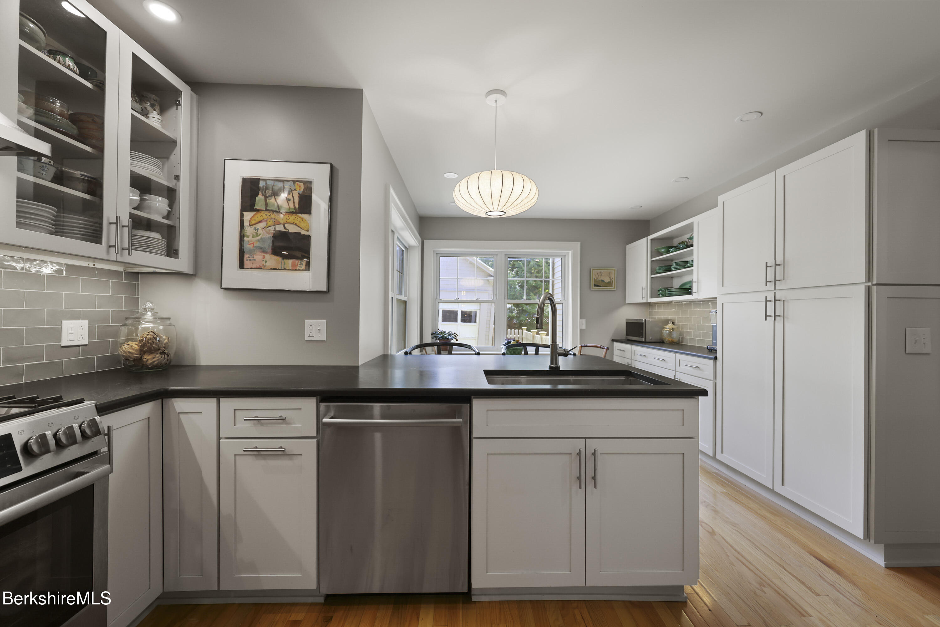 39 Lexington Parkway Pittsfield, MA 01201 - Photo 7 of 48 a kitchen with white cabinets and sink