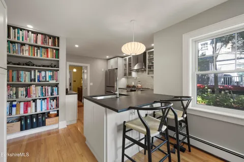 a view of a room that has a table and chairs