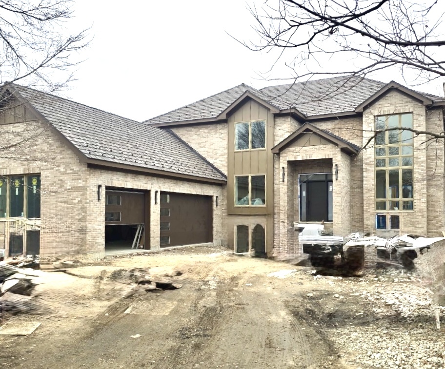 7234 Roxbury Court Long Grove, IL 60060 - Photo 1 of 17 a front view of a house with a yard and glass windows