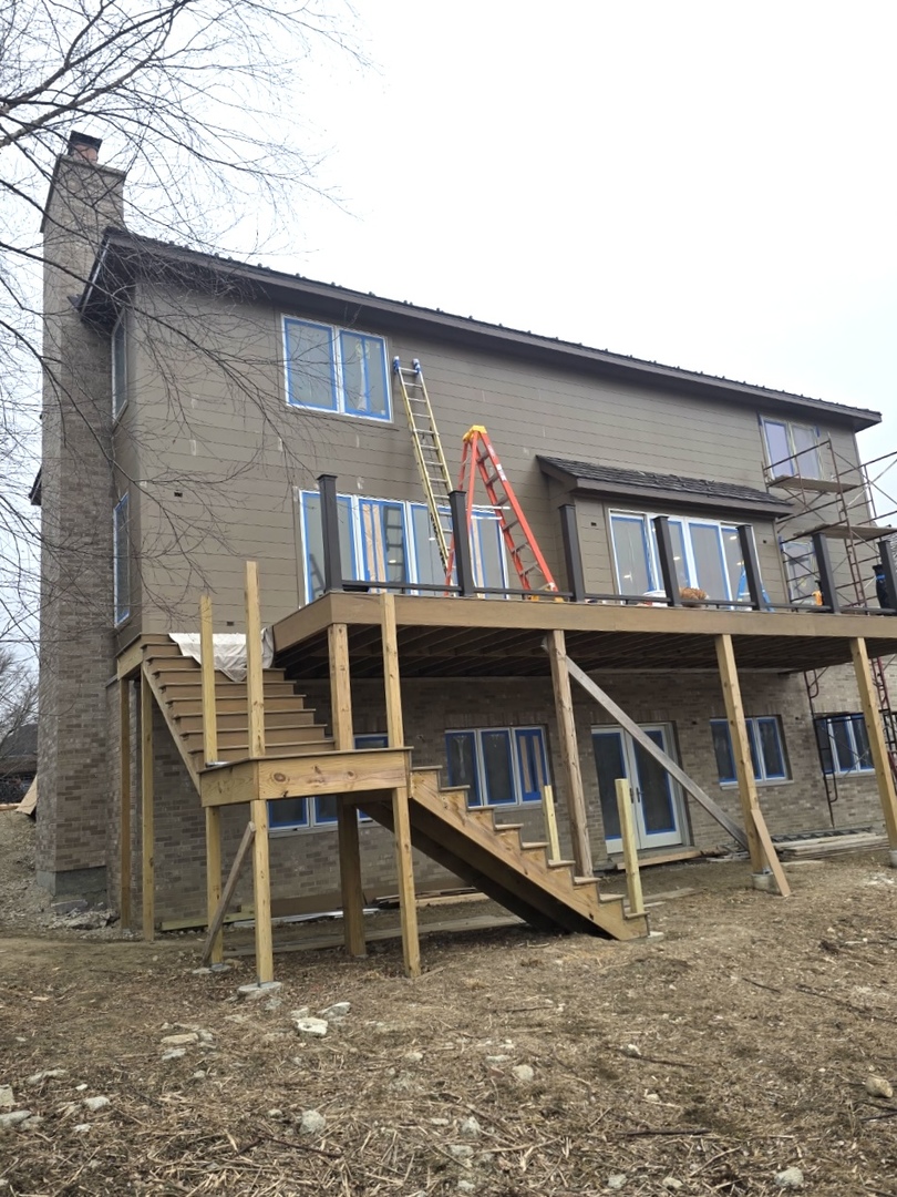7234 Roxbury Court Long Grove, IL 60060 - Photo 16 of 17 a white building with a roof deck
