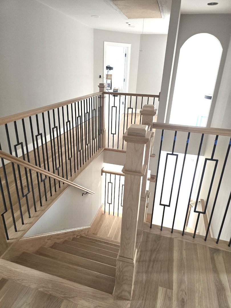 7234 Roxbury Court Long Grove, IL 60060 - Photo 19 of 34 a view of staircase with railing and a floor to ceiling window