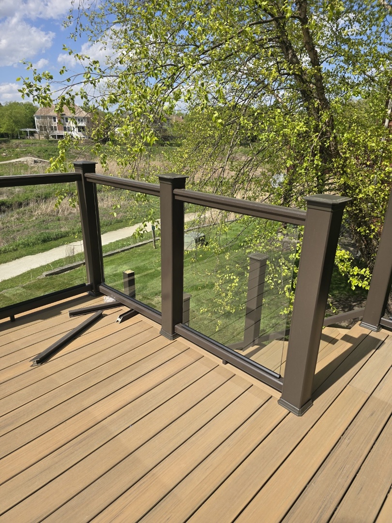 7234 Roxbury Court Long Grove, IL 60060 - Photo 29 of 34 a view of a balcony with lake view and a floor to ceiling window