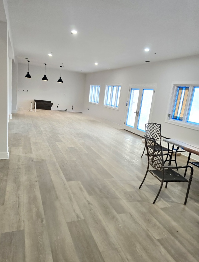 7234 Roxbury Court Long Grove, IL 60060 - Photo 6 of 17 a living room with furniture and a book shelf