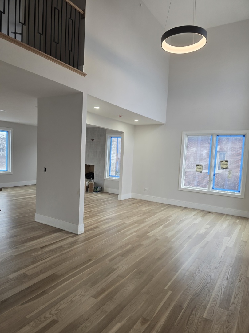 7234 Roxbury Court Long Grove, IL 60060 - Photo 7 of 17 a view of a room with wooden floor and window