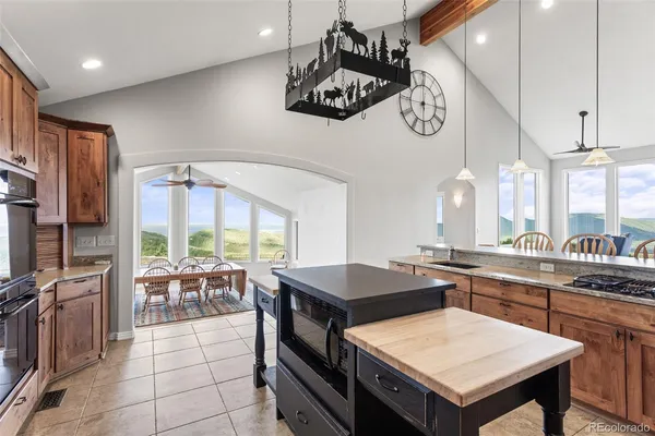 a kitchen with a table and chairs in it