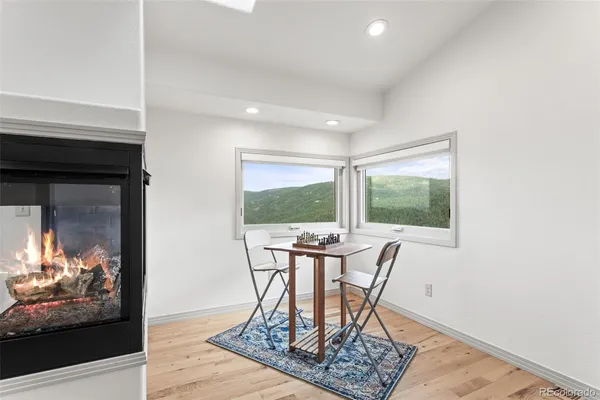 a view of a dining room with furniture window and outside view