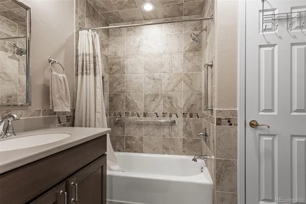 a bathroom with a bathtub and a sink