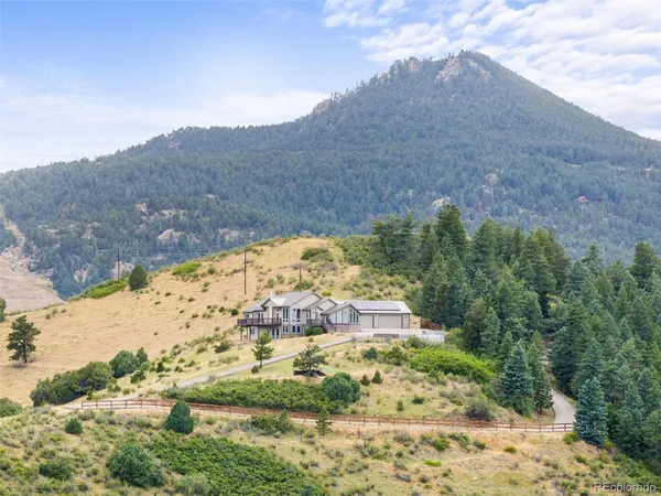 a view of a yard with a mountain