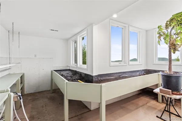 a living room with granite countertop furniture and a window