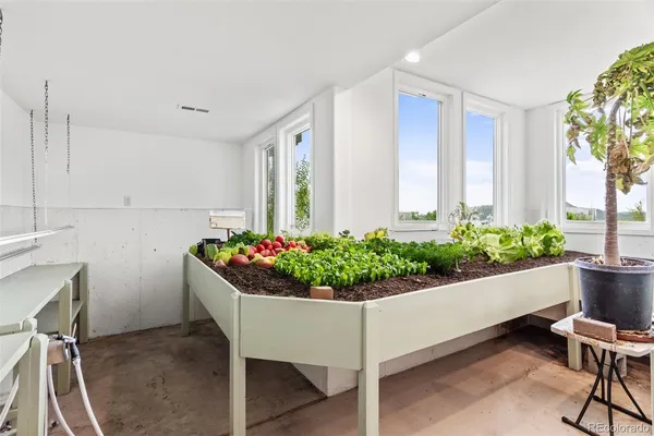 a house with a flower garden and chair