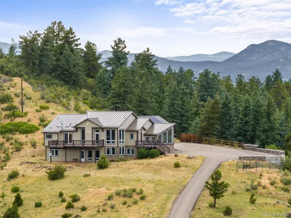 a view of a house with a big yard