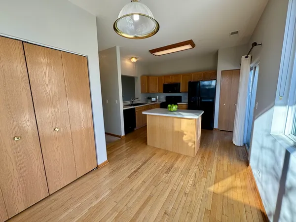 a view of a kitchen from the hallway
