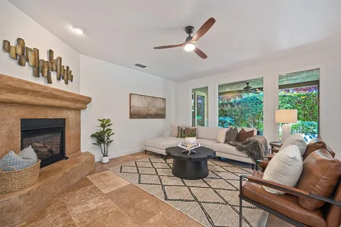 a living room with furniture and a fireplace
