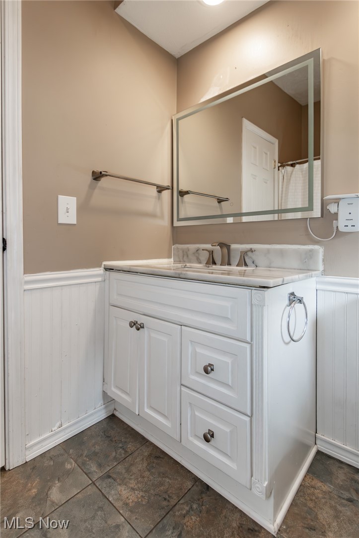 9723 Thwing Road Chardon, OH 44024 - Photo 20 of 42 Full bath with wainscoting and vanity