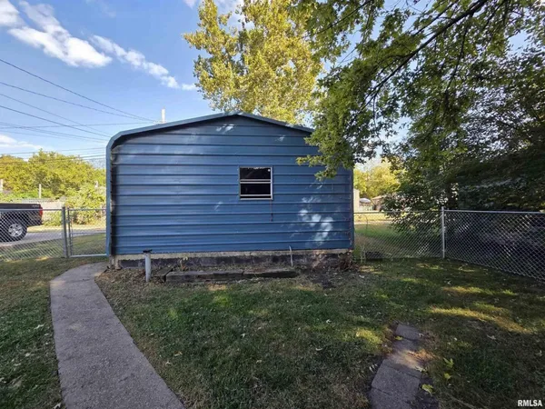 a view of a backyard with a large tree