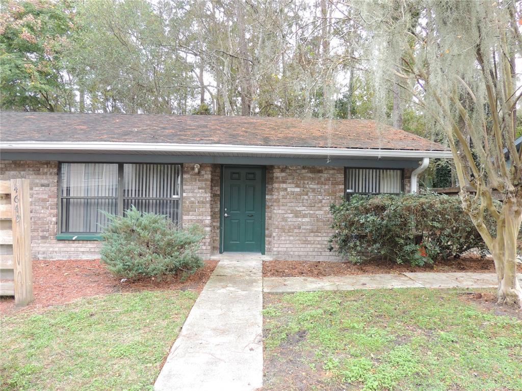 4649 Southwest 45th Lane Gainesville, FL 32608 - Photo 1 of 1 a front view of a house with garden