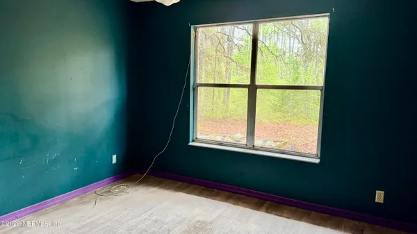 a view of an empty room with a window