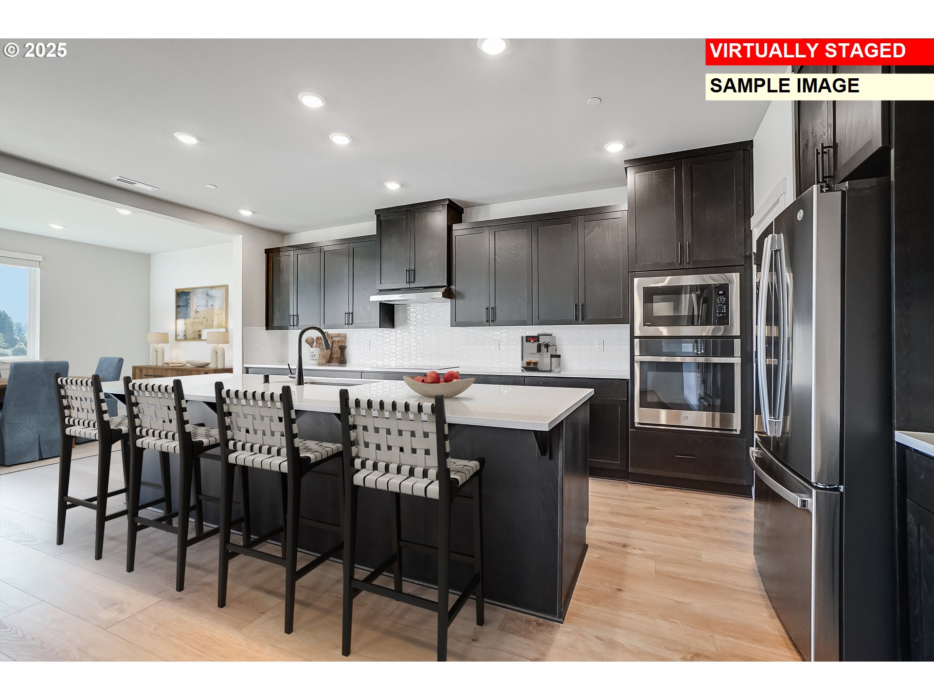 5486 North 88th Avenue Camas, WA 98607 - Photo 11 of 28 a kitchen with stainless steel appliances a refrigerator sink and cabinets