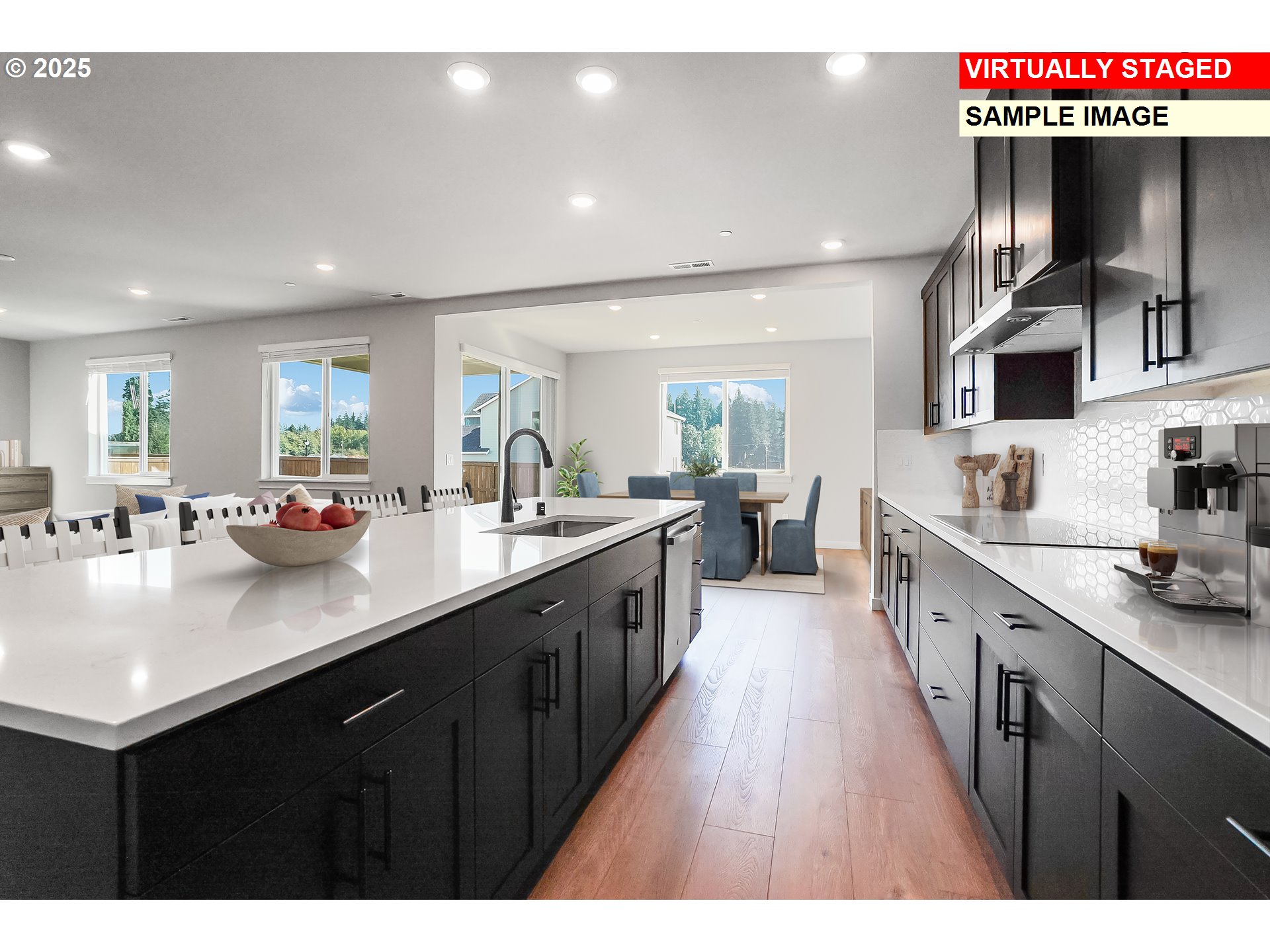 5486 North 88th Avenue Camas, WA 98607 - Photo 12 of 28 a large kitchen with stainless steel appliances a sink counter space and a window
