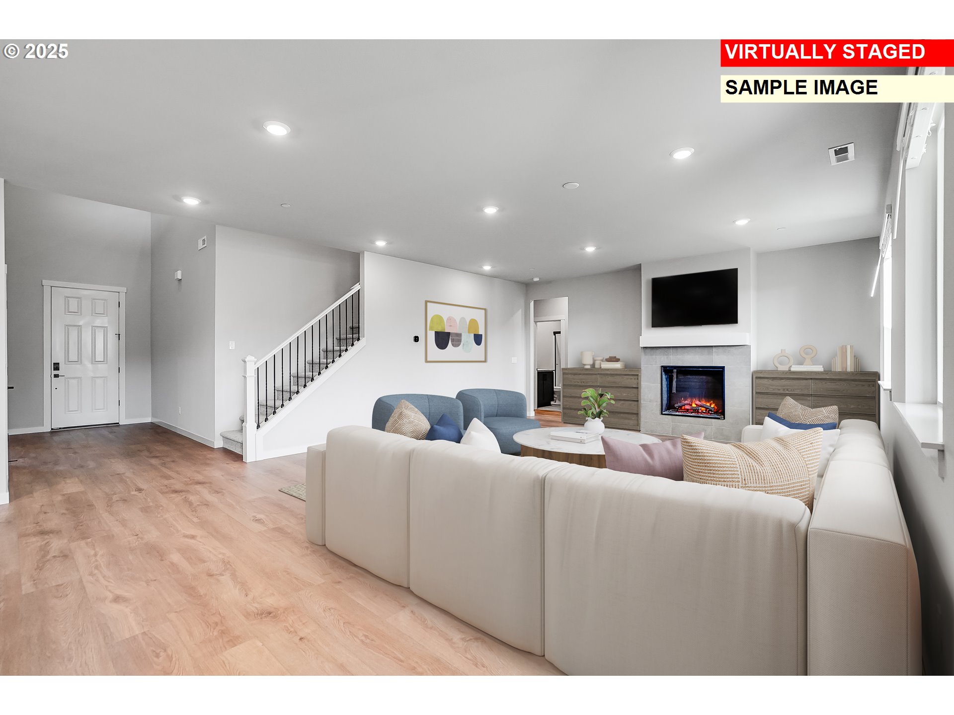 5486 North 88th Avenue Camas, WA 98607 - Photo 5 of 28 a living room with furniture a fireplace and a flat screen tv