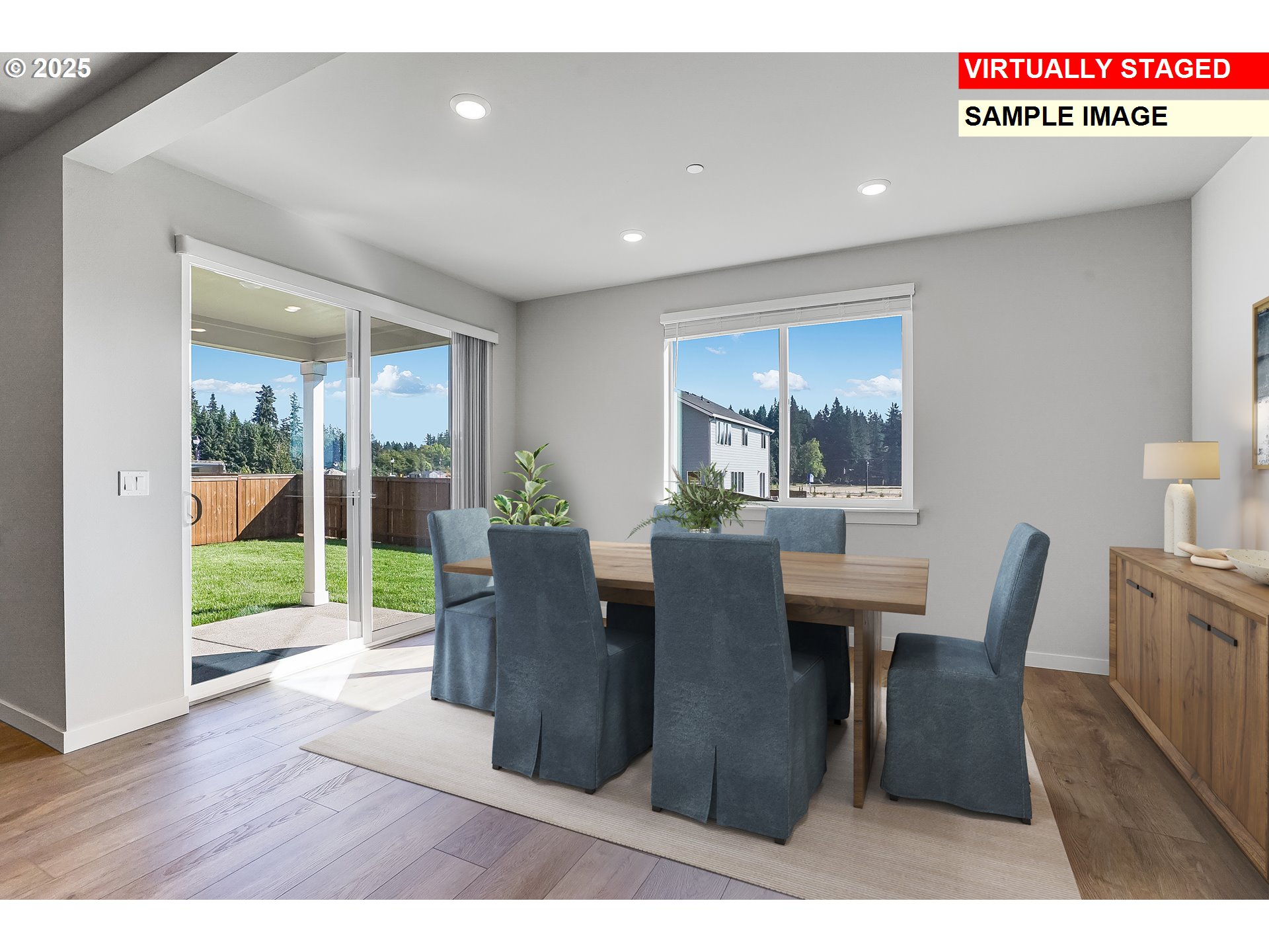 5486 North 88th Avenue Camas, WA 98607 - Photo 9 of 28 a view of a dining room with furniture window and wooden floor