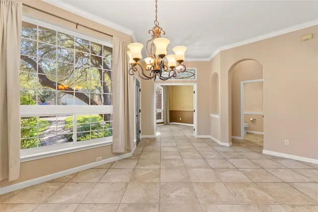 a view of a room with window and chandelier