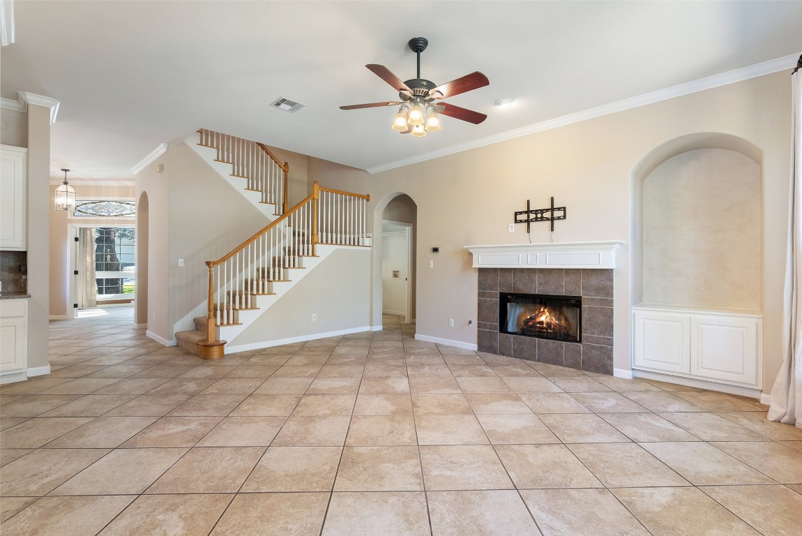 2932 Grimes Ranch Road Austin, TX 78732 - Photo 23 of 38 a view of an empty room and chandelier fan