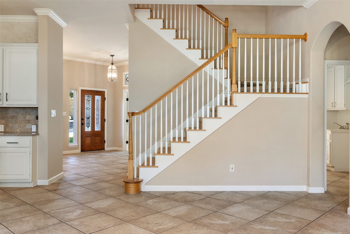 2932 Grimes Ranch Road Austin, TX 78732 - Photo 24 of 38 a view of a hallway with staircase