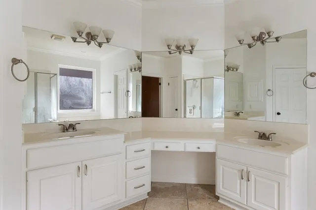 a bathroom with a sink vanity and mirror