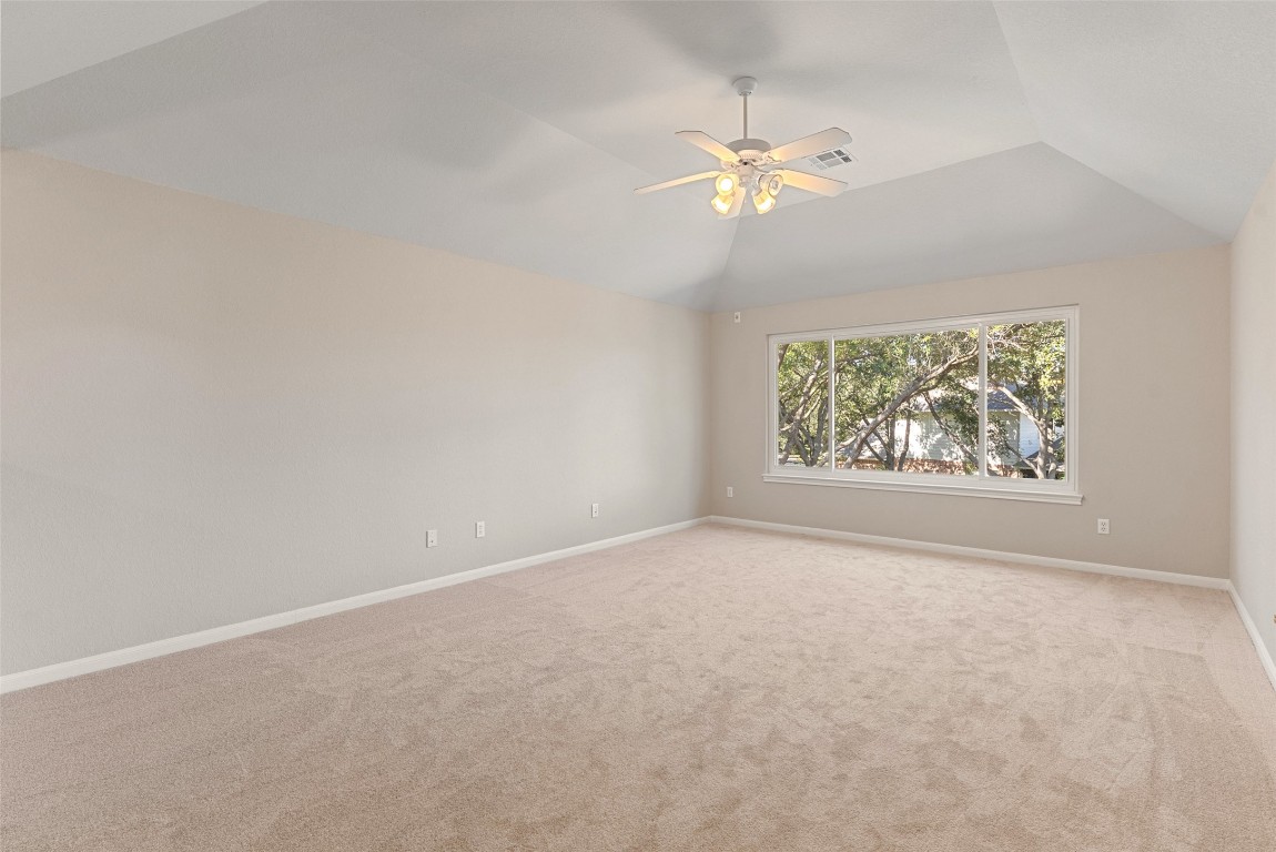 2932 Grimes Ranch Road Austin, TX 78732 - Photo 37 of 38 an empty room with a fan & a window