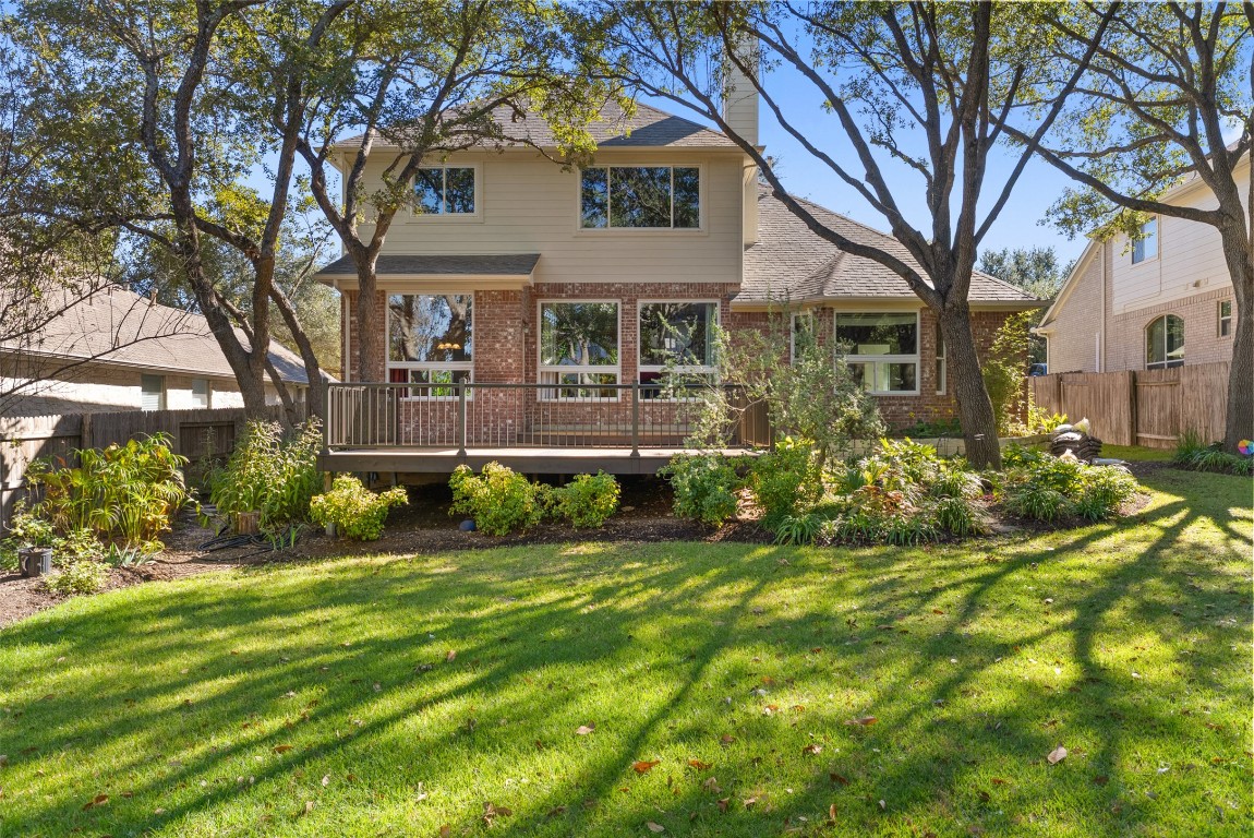 2932 Grimes Ranch Road Austin, TX 78732 - Photo 4 of 38 a view of a house with a yard