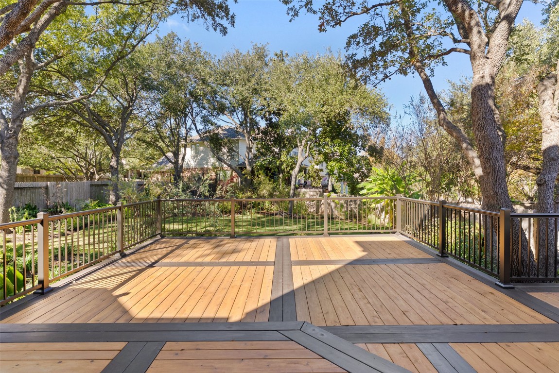2932 Grimes Ranch Road Austin, TX 78732 - Photo 5 of 38 a view of a balcony with wooden floor